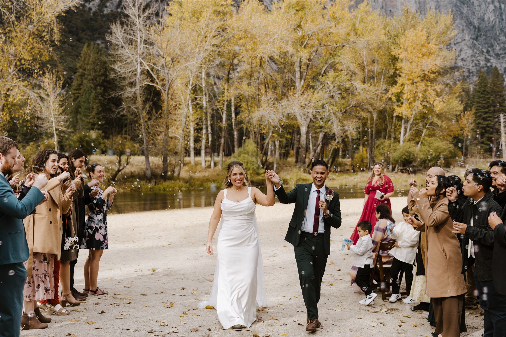 Couple walks back down the aisle after ceremony in Yosemite National Park